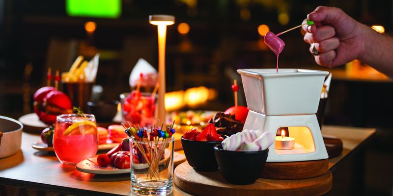 Fondue and drinks on a lounge table